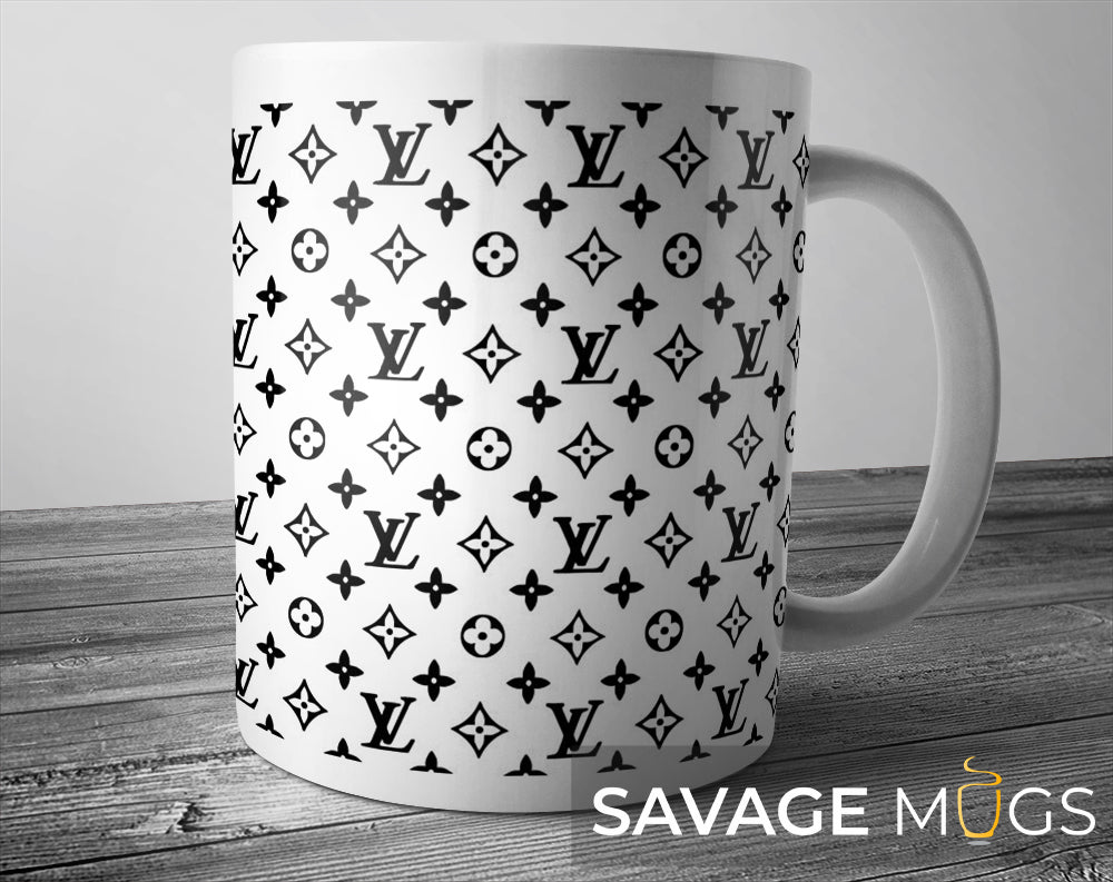 White ceramic mug with repeating designer inspired monogram pattern