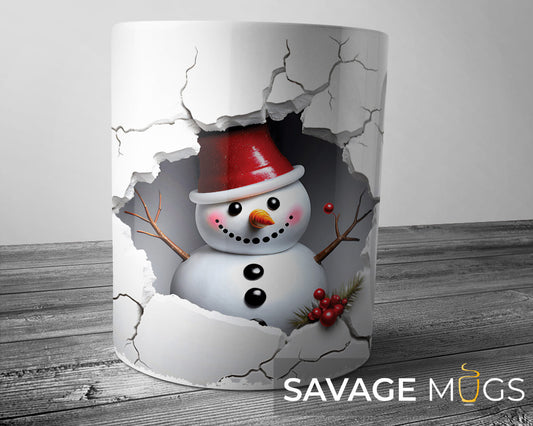 White ceramic mug with 3D illusion snowman breaking through cracked snowy wall Christmas design