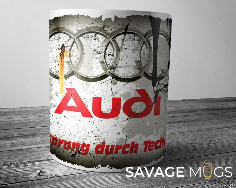 White ceramic mug featuring Audi logo with vintage grunge motorsport design