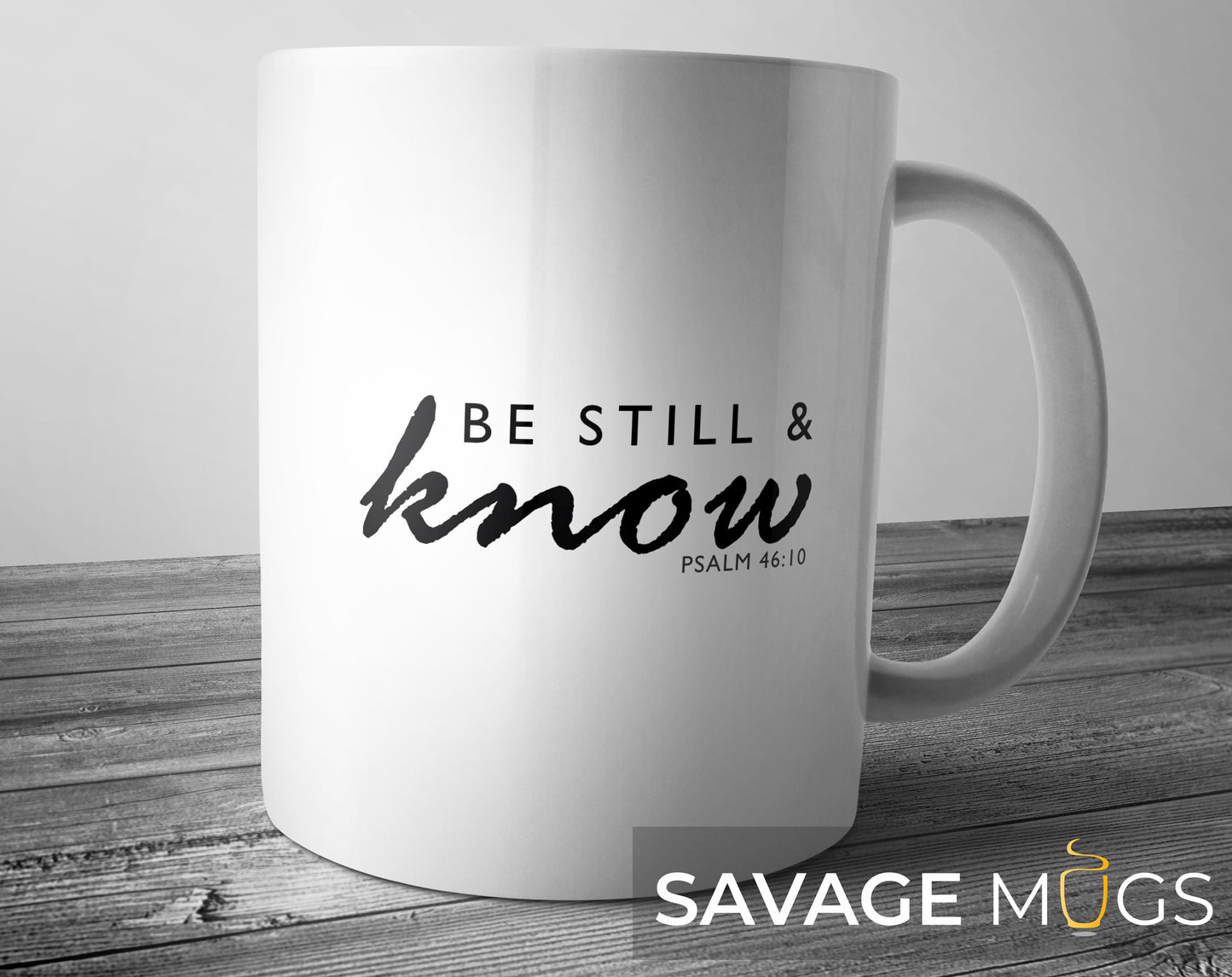 White ceramic mug featuring inspirational Christian Bible verse Be Still and Know Psalm 46:10