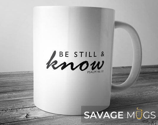 White ceramic mug featuring inspirational Christian Bible verse Be Still and Know Psalm 46:10