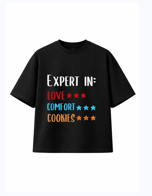 Black 300 GSM boxy fit cotton T-shirt with “Expert in Love Comfort Cookies” text and star rating design