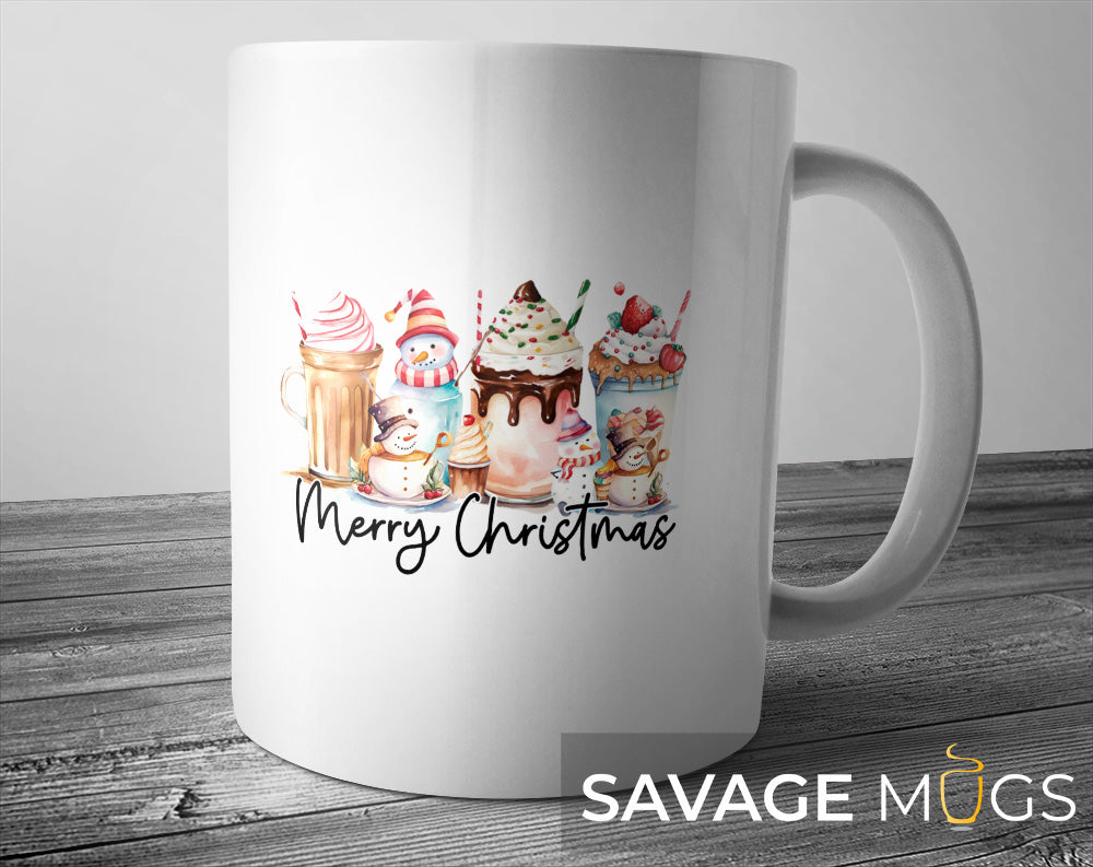 White ceramic mug with Merry Christmas text and snowman milkshake holiday illustration