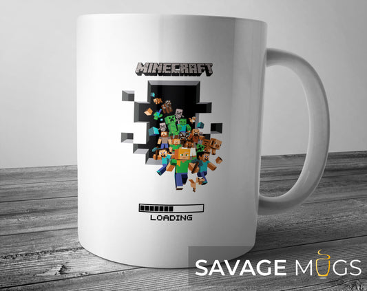 White ceramic mug with Minecraft loading bar and pixel characters gaming design