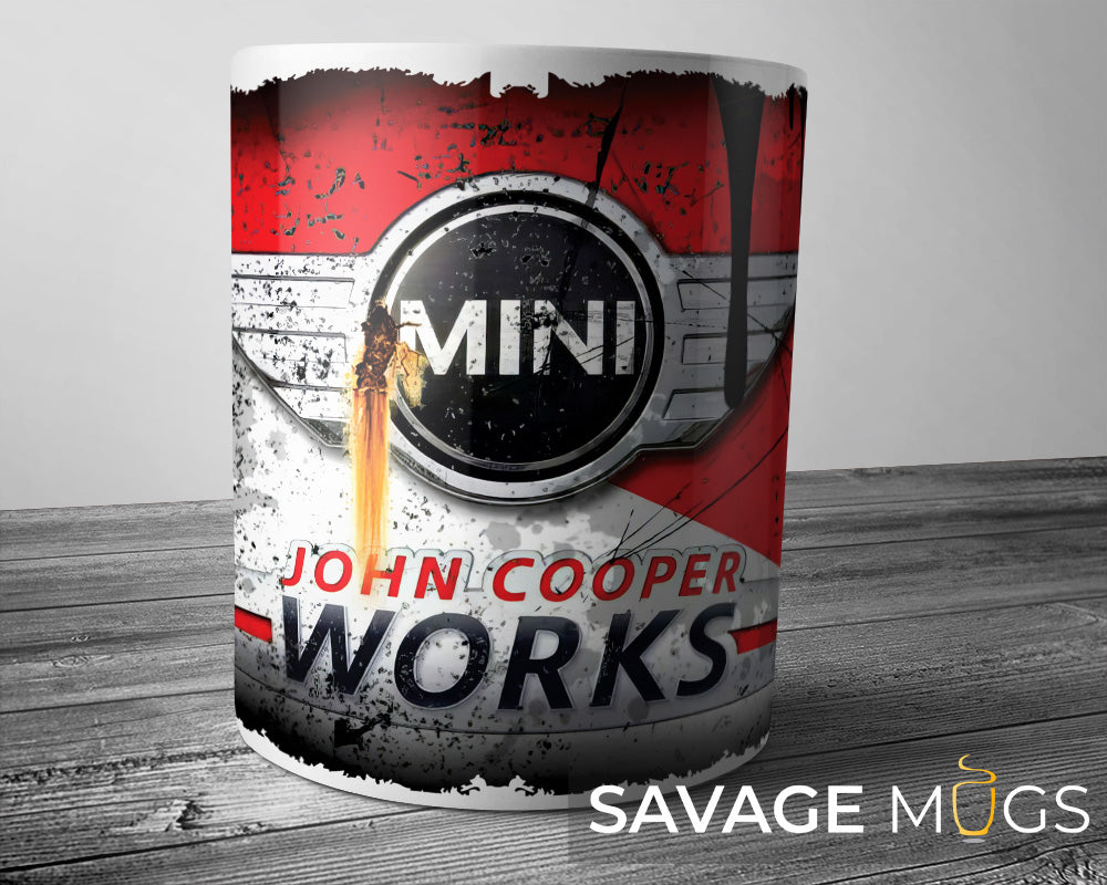 White ceramic mug featuring Mini John Cooper Works logo with vintage racing grunge design