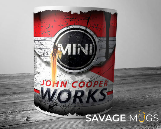 White ceramic mug featuring Mini John Cooper Works logo with vintage racing grunge design