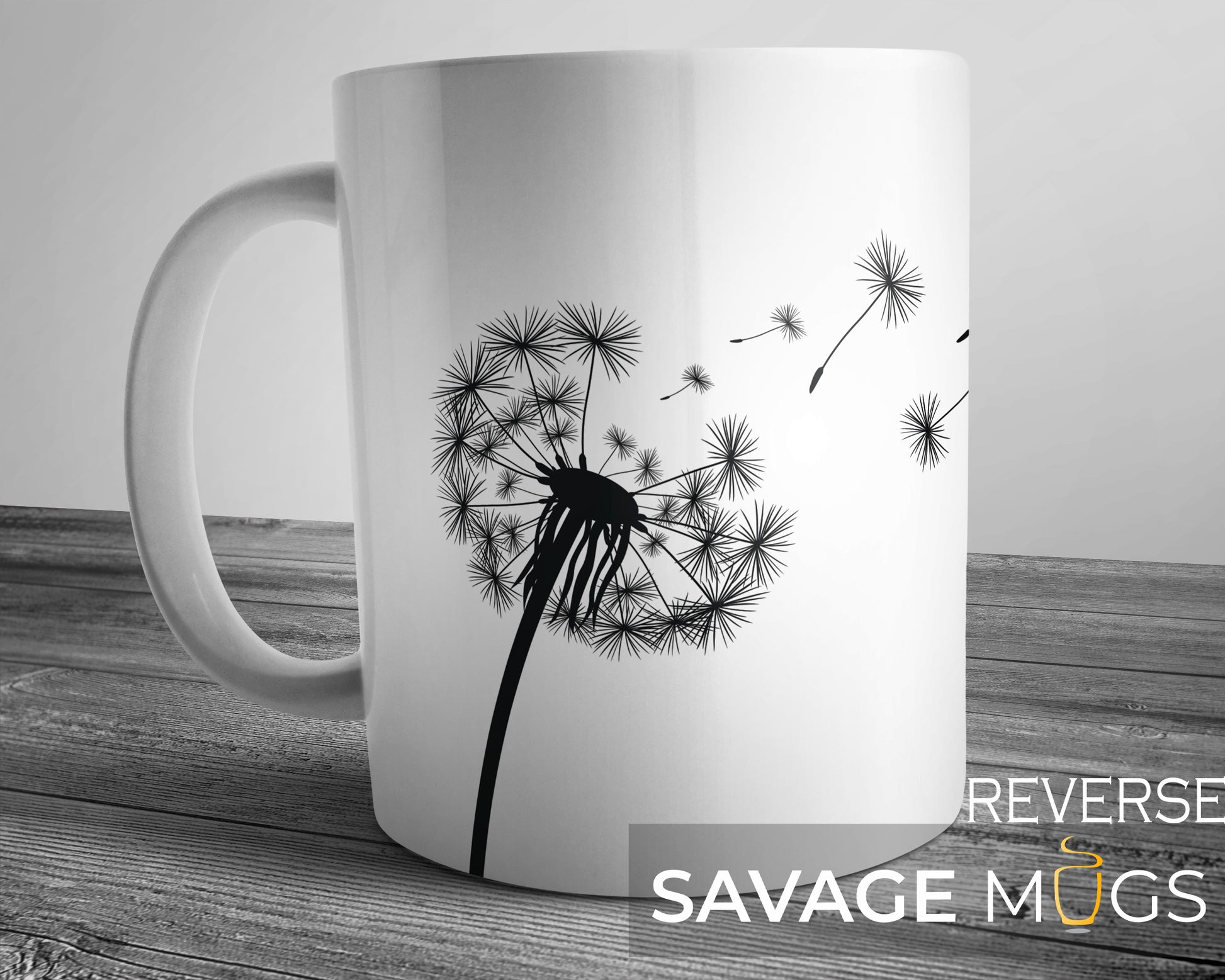 White ceramic mug with minimalist dandelion design and drifting seeds