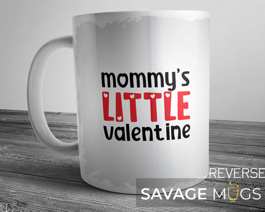 White ceramic mug with Mommy’s Little Valentine text and heart design