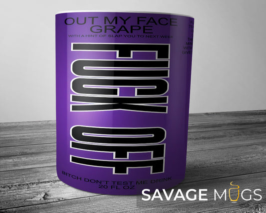White ceramic mug with purple novelty drink label design reading Out My Face Grape with humorous tagline