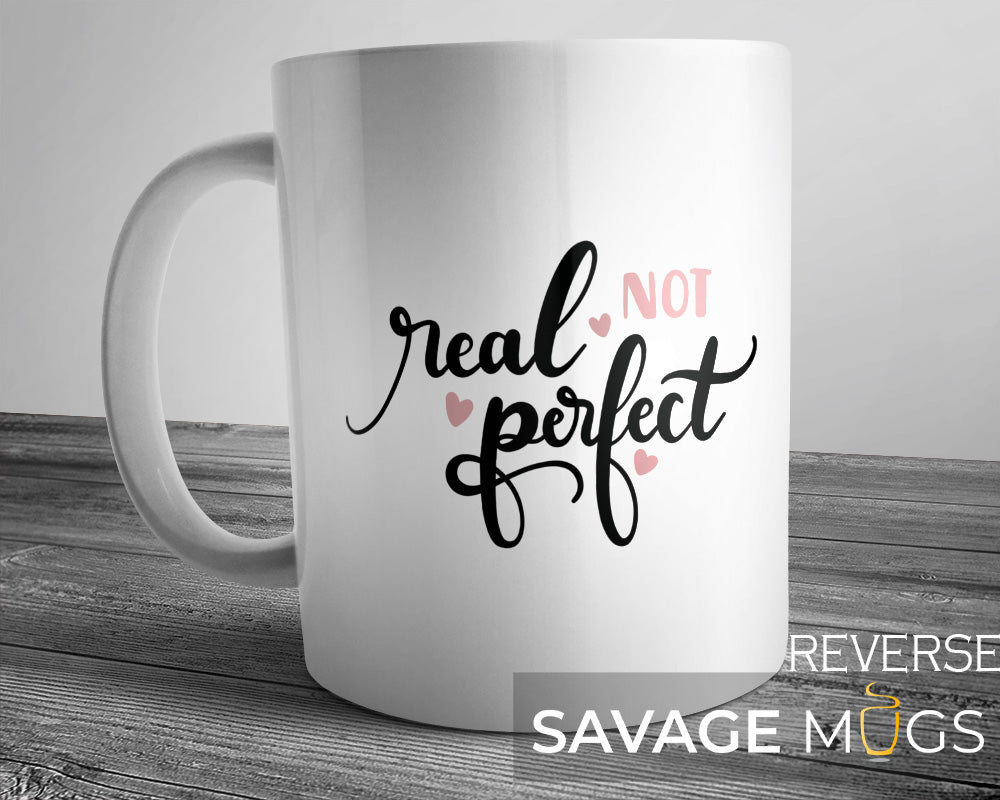 White ceramic mug with Real Not Perfect self-love quote design