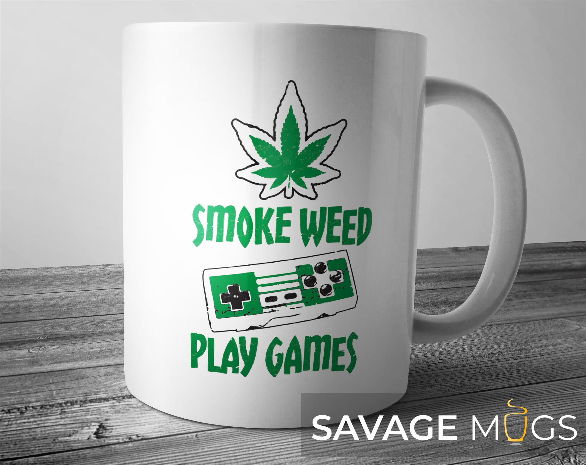 White ceramic mug with cannabis leaf and retro gaming controller design with Smoke Weed Play Games text