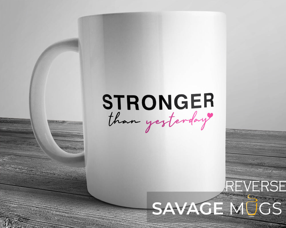 White ceramic mug with Stronger Than Yesterday motivational quote design
