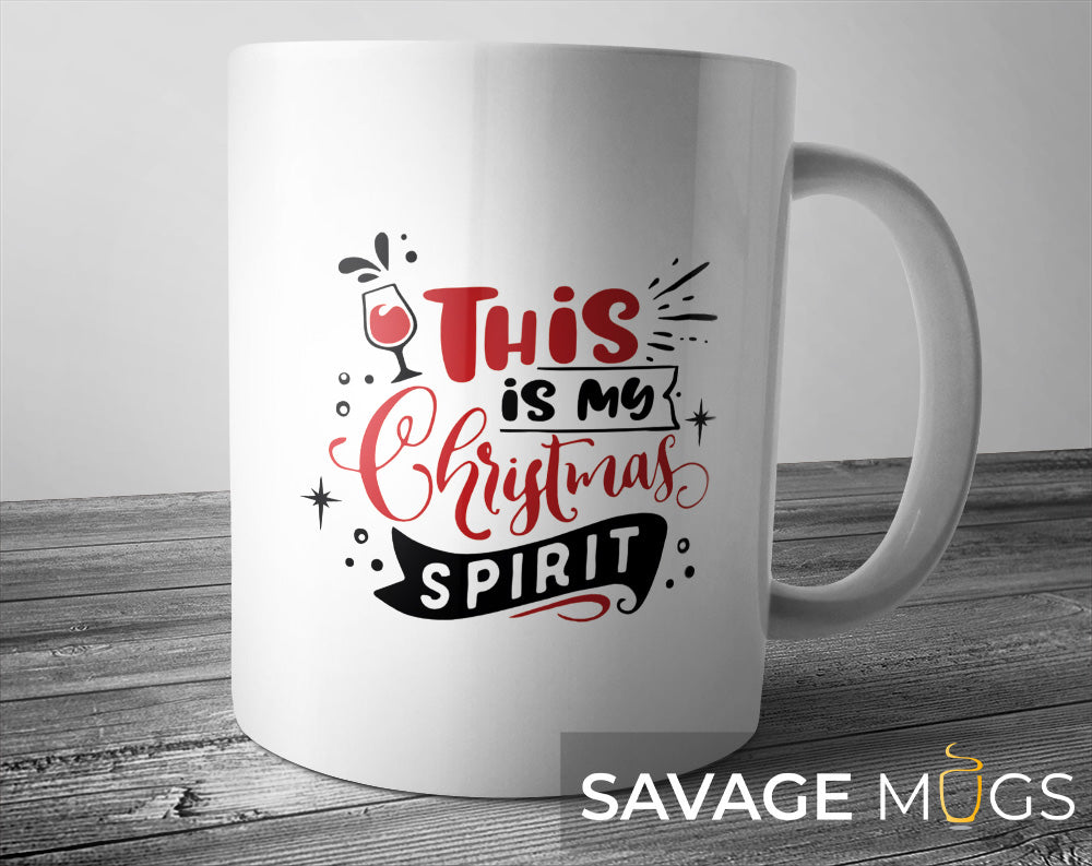 White ceramic mug featuring funny This Is My Christmas Spirit holiday design with wine glass