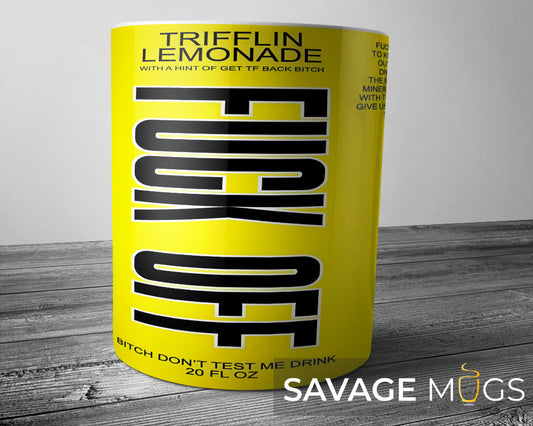 White ceramic mug with yellow parody drink label design reading Trifflin Lemonade with humorous beverage-style graphics