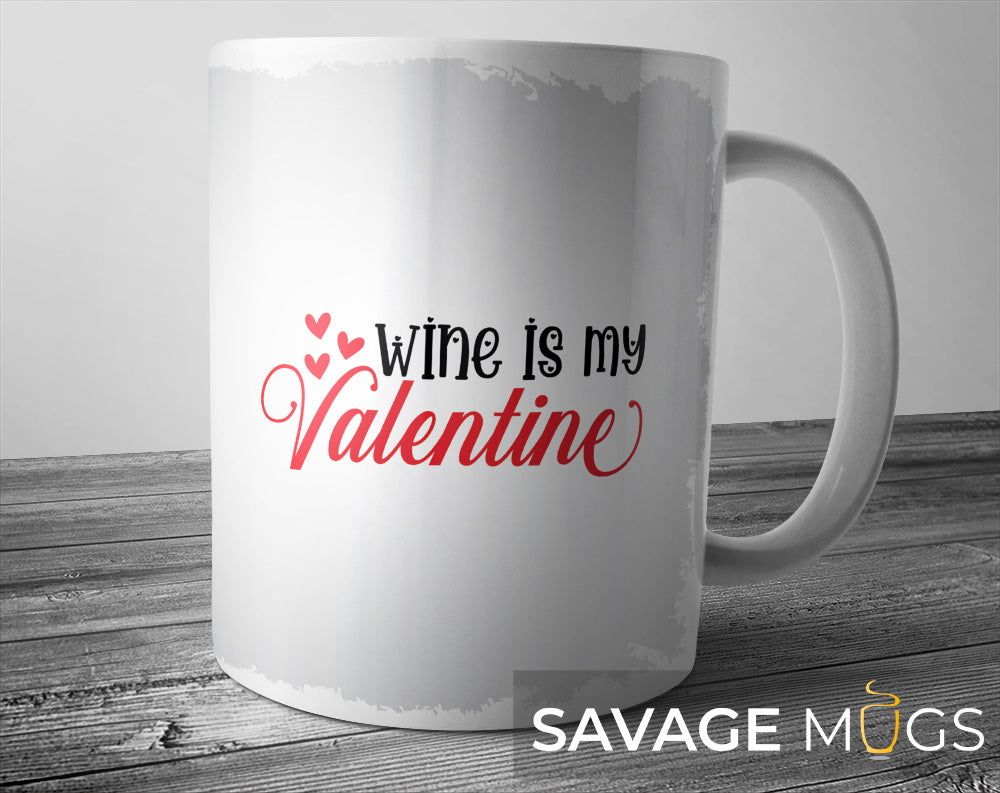 White ceramic mug with Wine Is My Valentine text and heart design