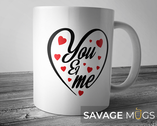 White ceramic mug with You and Me heart design and red hearts